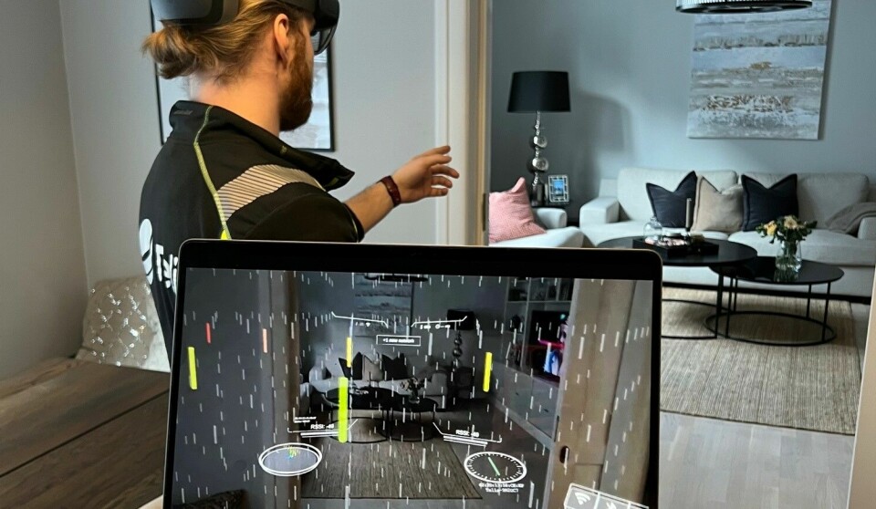 GULE STOLPER: Ved hjelp av AR-briller kan Telias servicefolk se wifi-signalene i rommet. Det de ser gjennom brillene vises her på PC-skjermen. Ved å klikke på stolpene 'i løse lufta' kommer informasjon opp. (Foto: Telia)