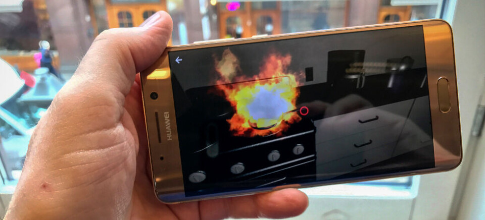 3D I 2D: Slik ser en smultbrann ut i 3D-appen VR House Fire. Opplevelsen blir mye mer realistisk med VR-briller på. (Foto: Toralv Østvang) 3D I 2D: Slik ser en smultbrann ut i 3D-appen VR House Fire. Opplevelsen blir mye mer realistisk med VR-briller på. (Foto: Toralv Østvang)